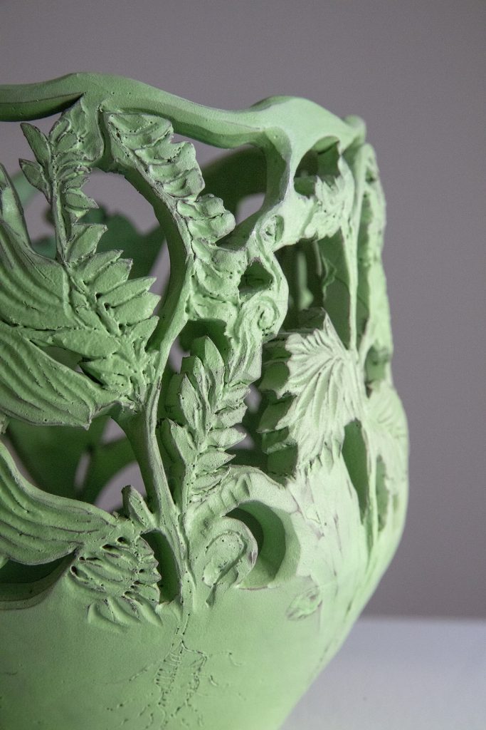 Detail of a green vase.