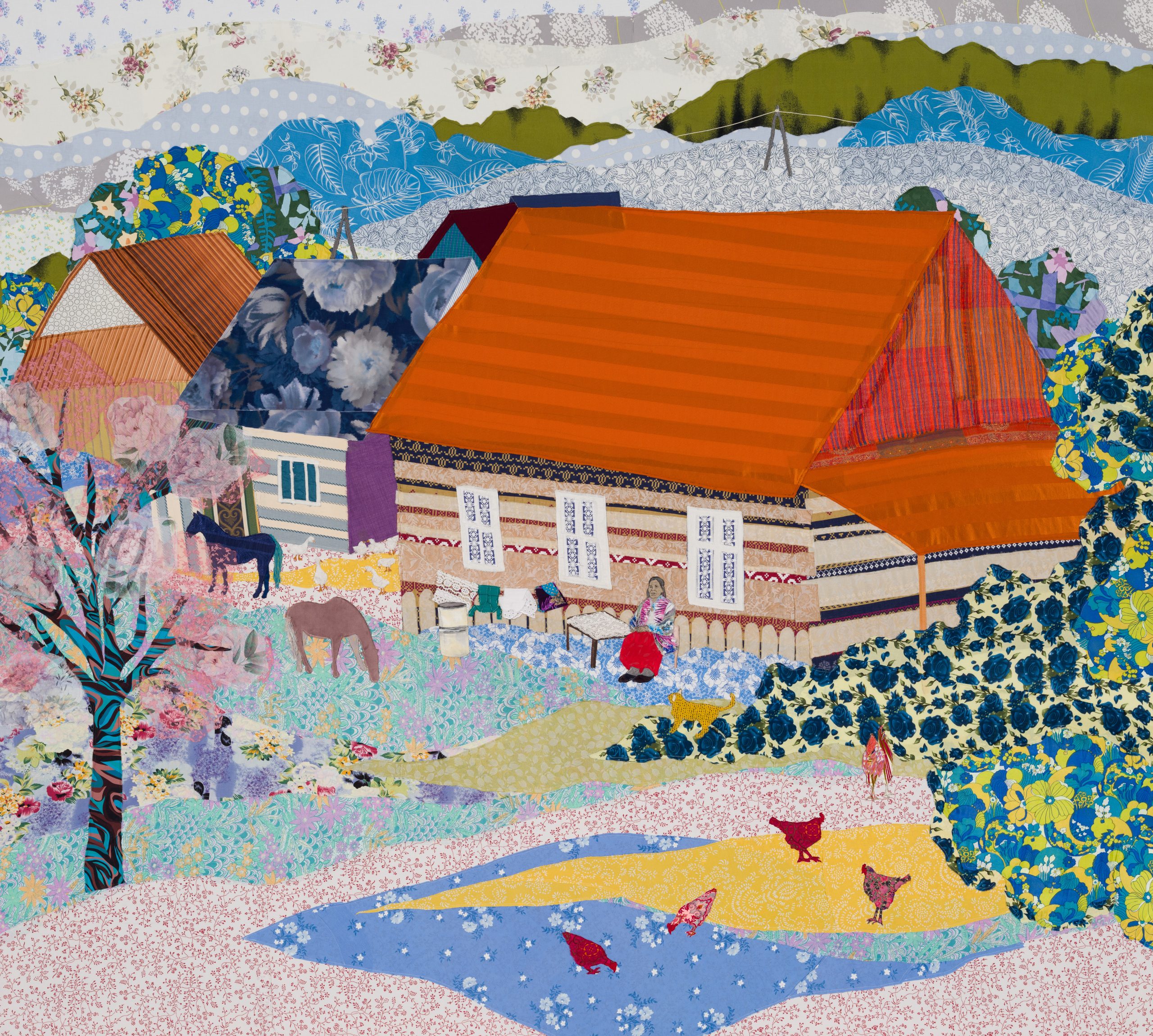 A textile artwork of a house.
